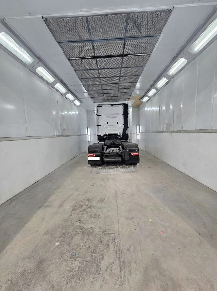 HGV tractor unit inside the spray booth at a partner bodyshop